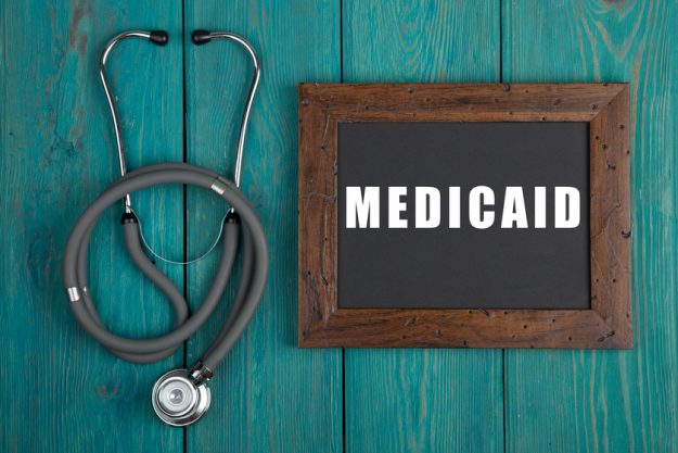 Blackboard with text “Medicaid” and stethoscope Blackboard with text "Medicaid" and stethoscope