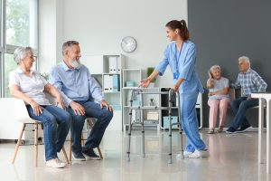 Elderly people with caregiver in nursing home