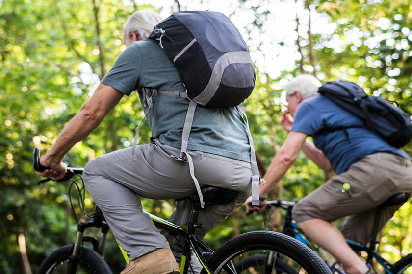 Group of seniors biking in the park