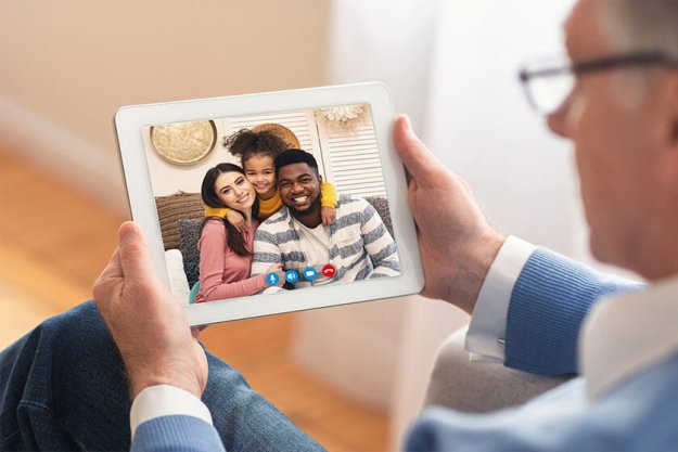 Man making video call with family using smartphone