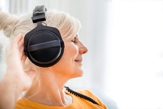 Relaxed senior woman listening her favourite music