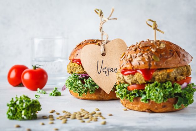 Vegan lentil burgers with kale and tomato sauce