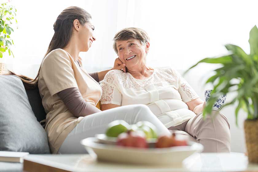 Woman talking with elderly mother
