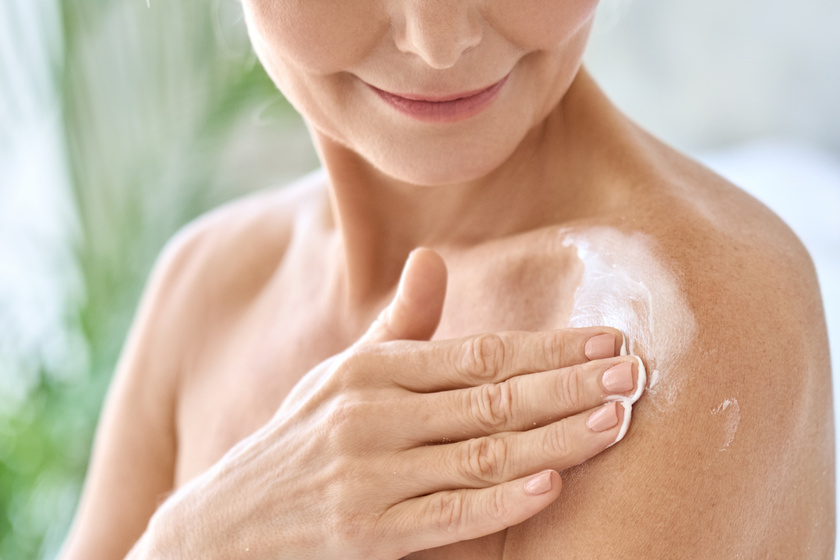 Closeup cut view of mid age woman applying body cream. Antiage skincare concept. Why You Should Protect Your Aging Skin From UV Light