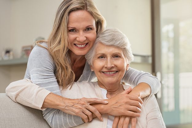 Woman hugging mother with love Woman hugging mother with love