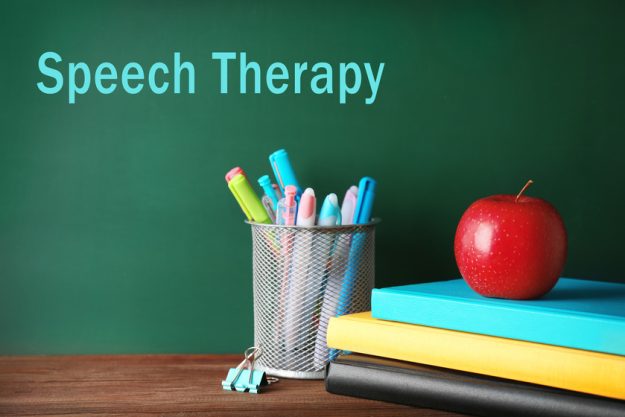 Colorful school stationery on table on blackboard background How Speech Therapy Dementia Activities Help Improve Communication Skills