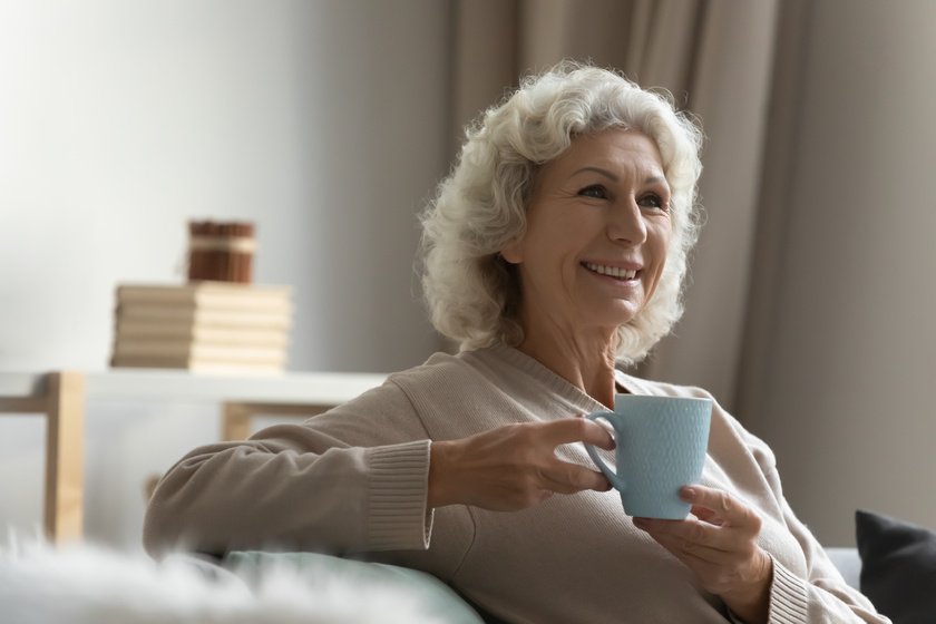 Happy elderly lady enjoying cup of hot beverage at home Here's What Our Residents Say About Morada Grand Prairie Senior Living