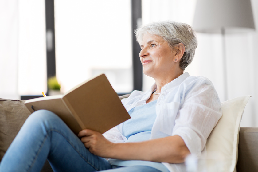 senior woman writing to notebook or diary at home Moving To Assisted Living Home In Belen, NM: A Packing Checklist