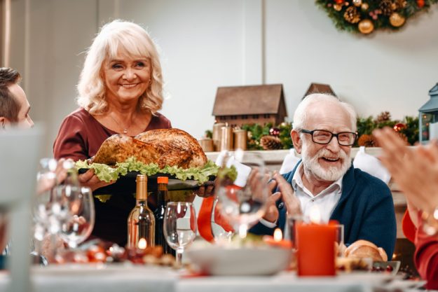 senior couple at christmas table
