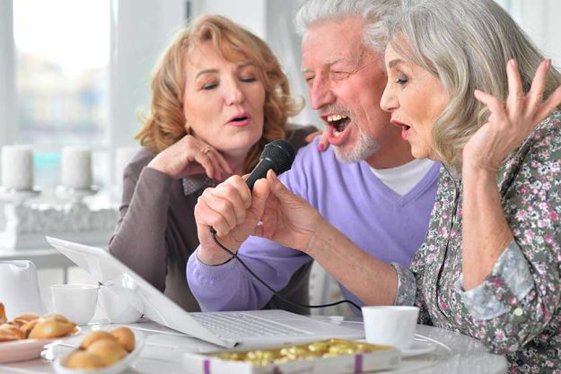 Elderly people singing karaoke