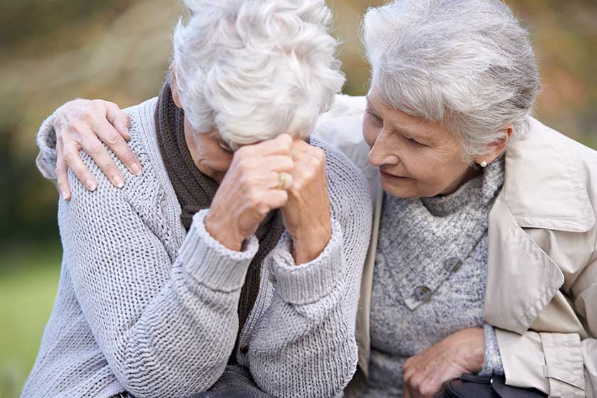We are always there for each other. A senior woman consoling her friend as they sit outdoors. We are always there for each other. A senior woman consoling her friend as they sit outdoors.
