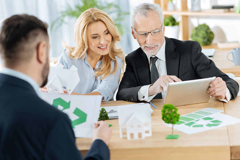 Cheerful engineers looking at the tablet Cheerful engineers looking at the tablet