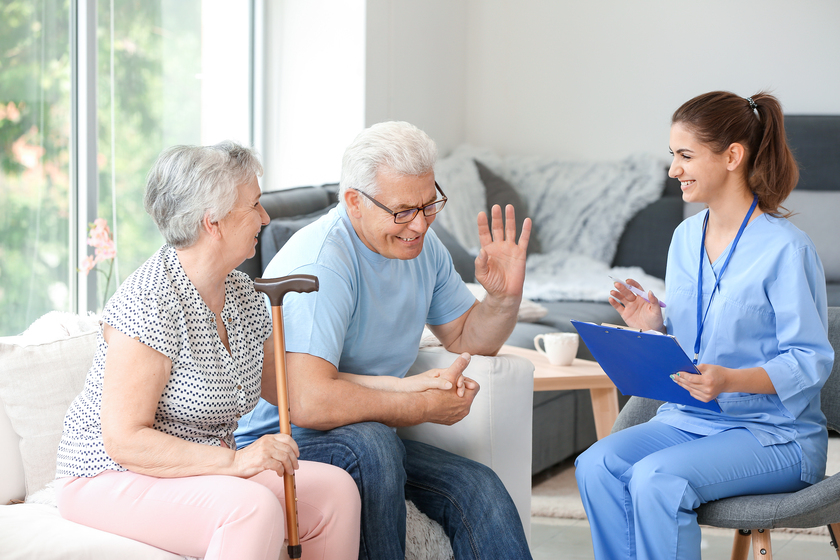 Elderly couple with caregiver in nursing home Assisted Living In Mansfield, TX: What If Your Parents Have Different Care Needs?