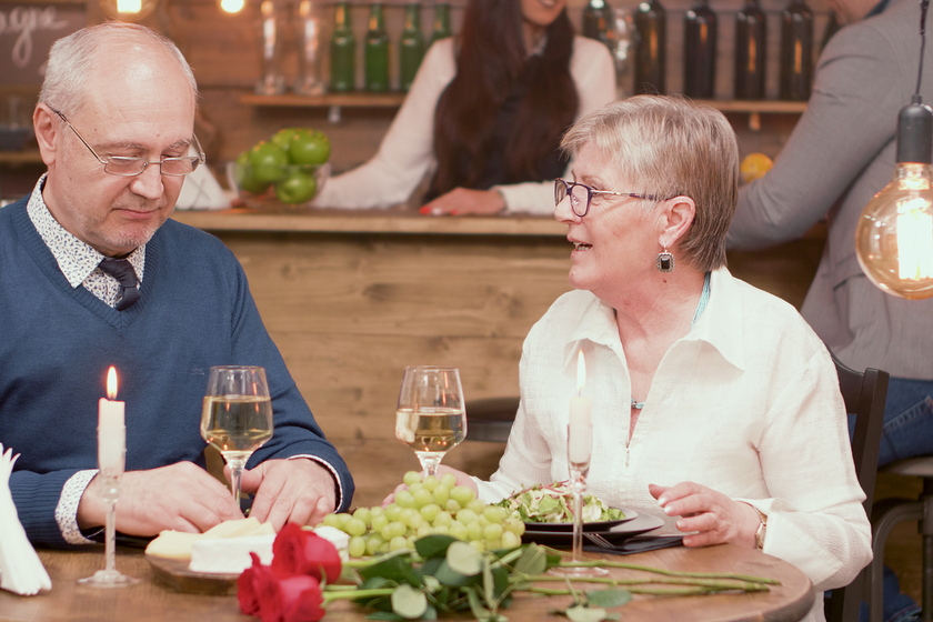 Two old friends in their sixties catching up on what they’ve been up to lately over dinner in a restaurant Debunking 6 Myths About Dining Programs In Senior Living In Cedar Hill, TX
