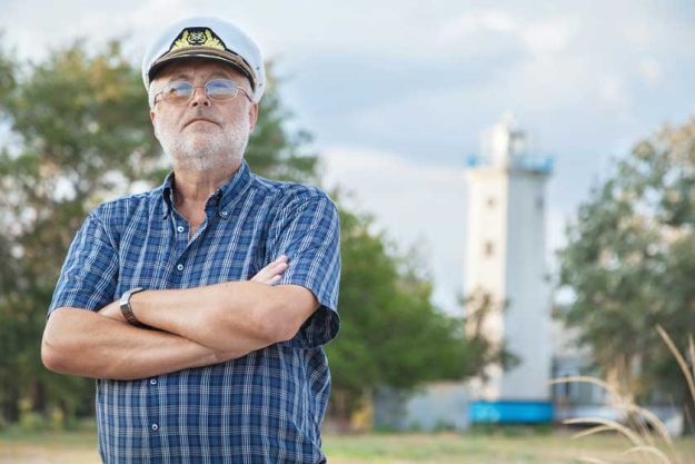 Elderly captain on the sea shore