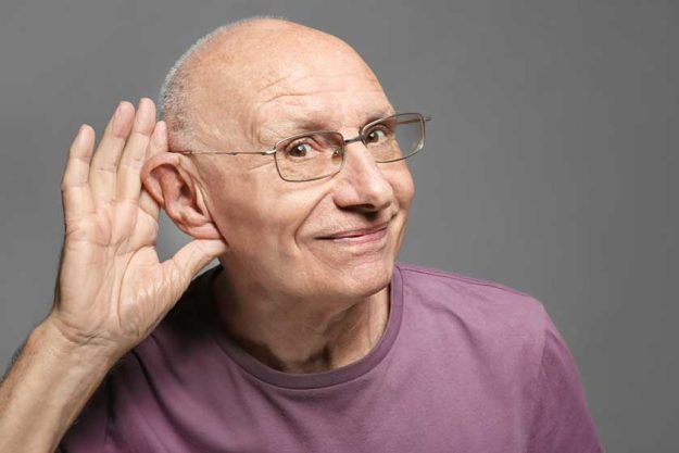 Elderly man with hearing problem Elderly man with hearing problem