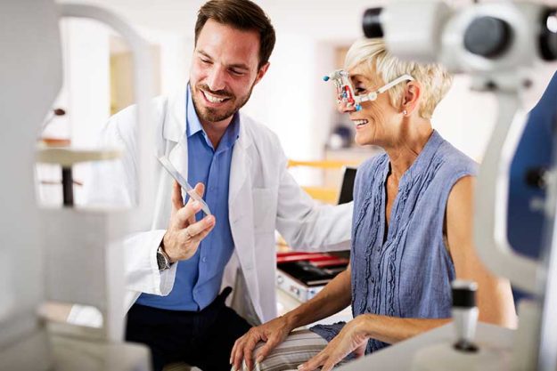 Older lady taking an eyesight test examination Older lady taking an eyesight test examination