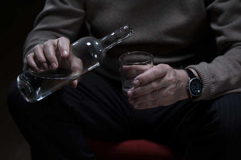 Pouring alcohol to the glass