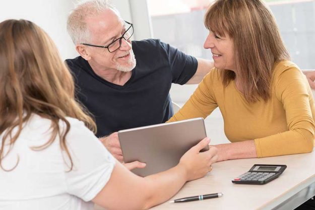 Senior couple meeting real estate agent Senior couple meeting real estate agent