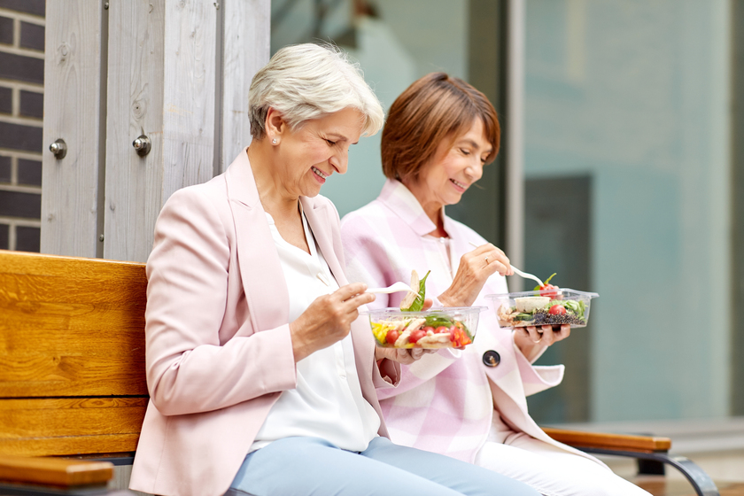 senior women eating takeaway food on city street What You Can Do To Share Your Stories When Staying At Senior Apartments In Sublett, TX