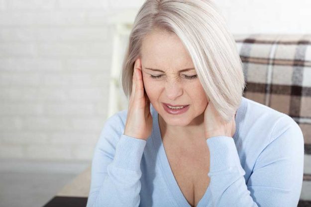 Woman suffering from stress or a headache Woman suffering from stress or a headache