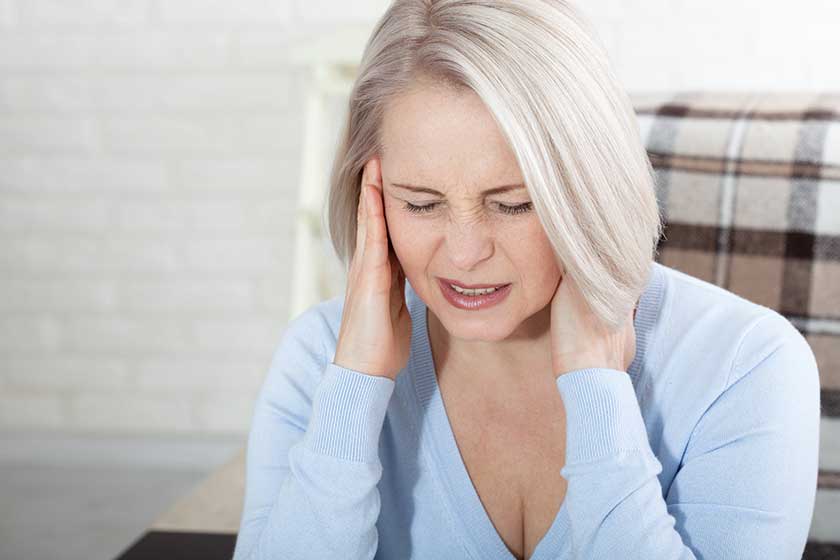 Woman suffering from stress or a headache Woman suffering from stress or a headache