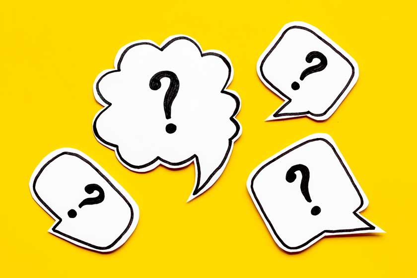 Ask question concept. Question mark on speech bubbles, top view