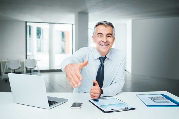 Businessman giving an handshake Businessman giving an handshake