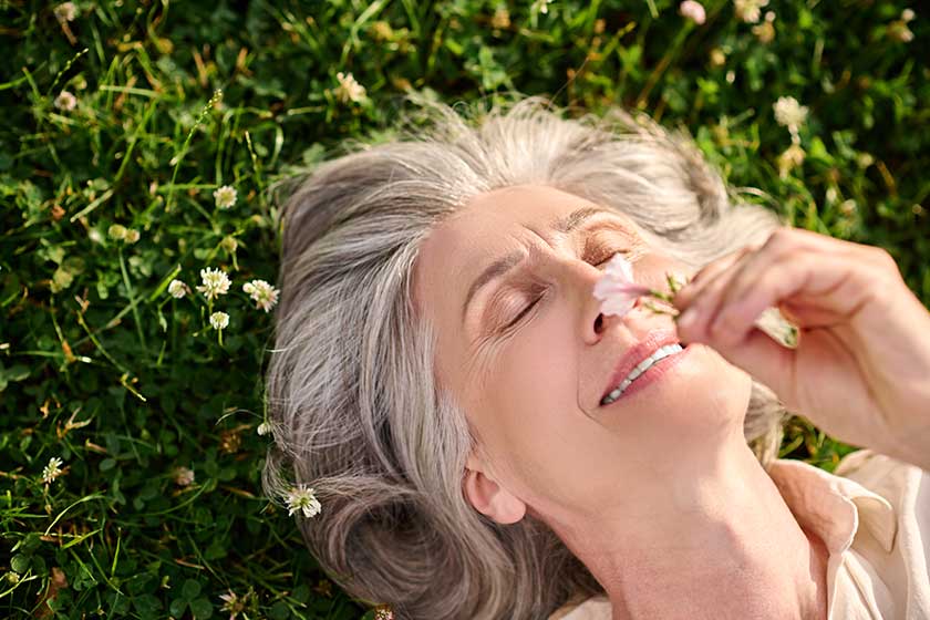 woman lying on grass