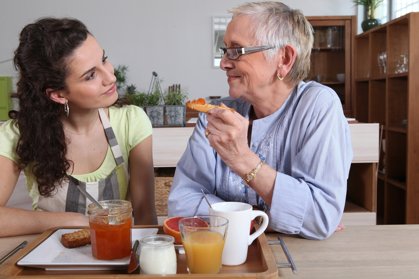 Grandmother and granddaughter having breakfast 9 Ways Assisted Living In Sardis, TX Encourages Seniors With No Appetite To Eat