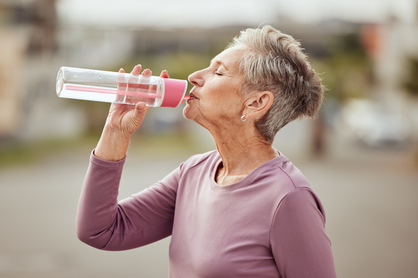 Fitness, runner or senior woman drinking water with sports goals resting or relaxing on break. Healthy, tired or thirsty elderly lady drinks natural liquid in cardio workout, training or exercise How Senior Living In Baytown, TX Helps You Build Healthy Habits