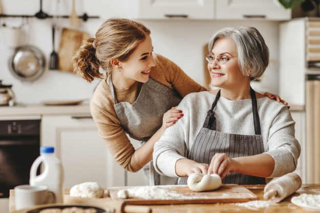 happy family grandmother old mother mother-in-law and daughter-in-law daughter cook in kitchen, knead dough, bake cookies Improving Your Manual Dexterity: X Easy Activities And Exercises You Can Do In Tulsa, OK Independent Living Home Care