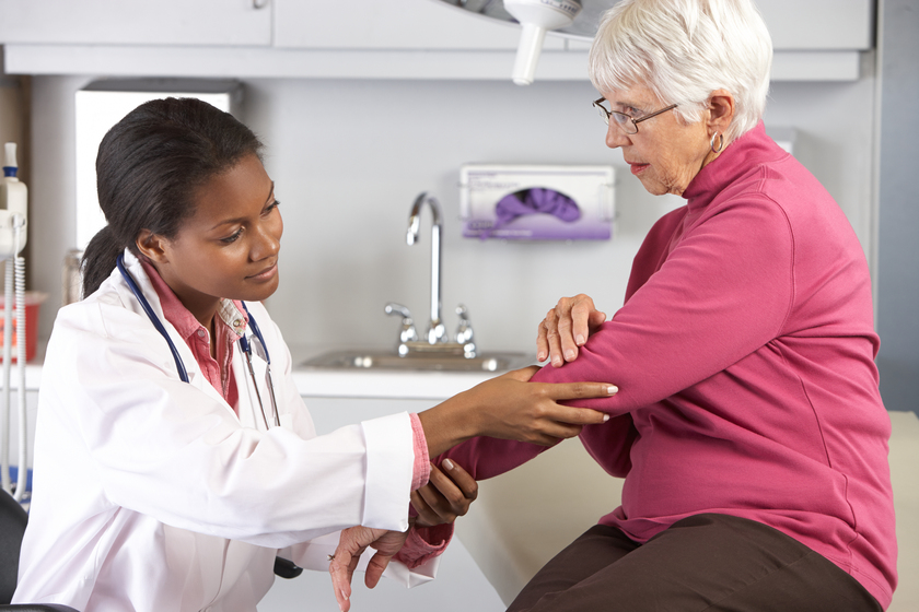 Doctor Examining Female Patient With Elbow Pain 7 Ways Senior Living Motivates Seniors To Go For Regular Health Checkup