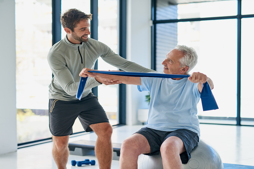 This routine has been good for me. a young male physiotherapist helping a senior man stretch with a stretching band in a fitness centre. 5 Things Assisted Living Should Have To Provide A Healthy Aging Model For Your Loved Ones