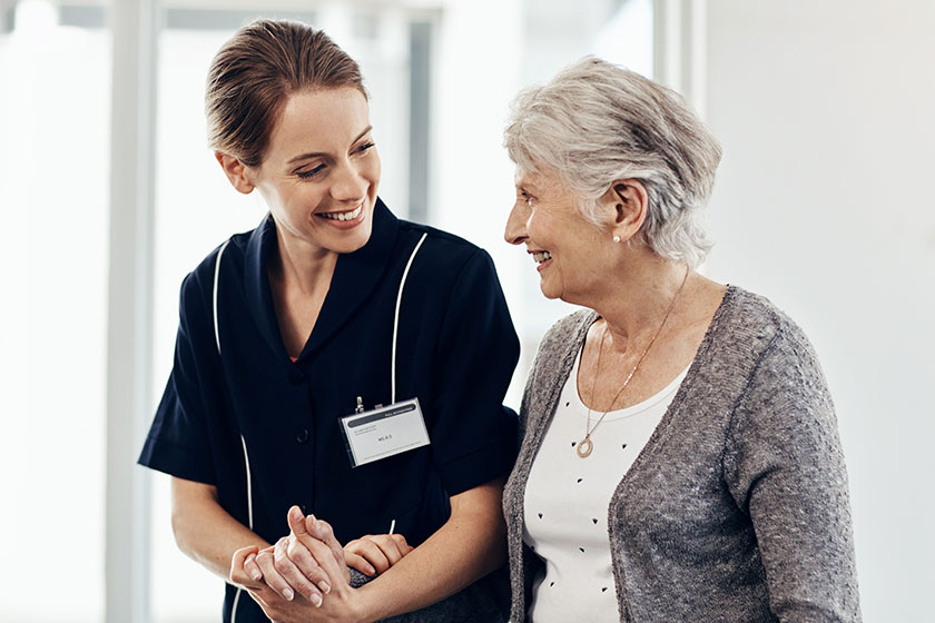 a female nurse caring for a senior woman