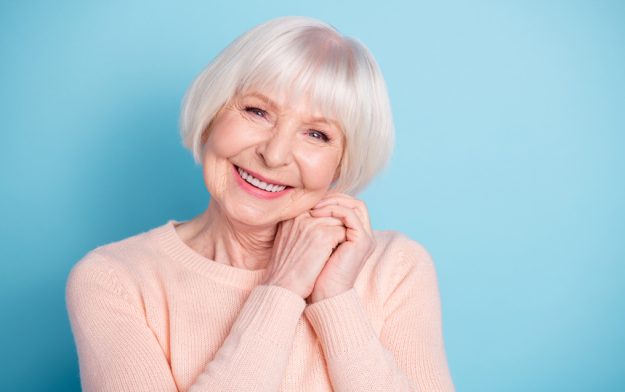Close-up portrait of her she nice-looking attractive lovely sweet healthy groomed cheerful cheery glad gray-haired lady enjoying good life isolated over bright vivid shine blue green teal background Lifestyle Changes You Should Make To Reduce Anxiety As You Age In Senior Living Homes In Cypress, TX