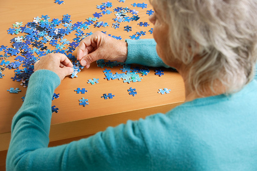 Mature woman doing puzzle