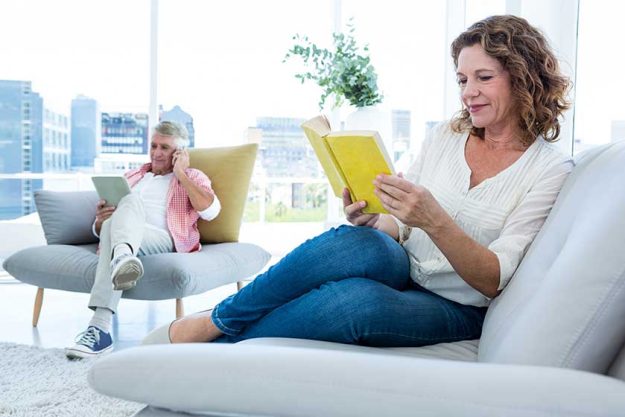 Woman reading book at home