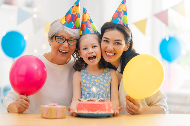 The kid is blowing out the candles on the cake The kid is blowing out the candles on the cake