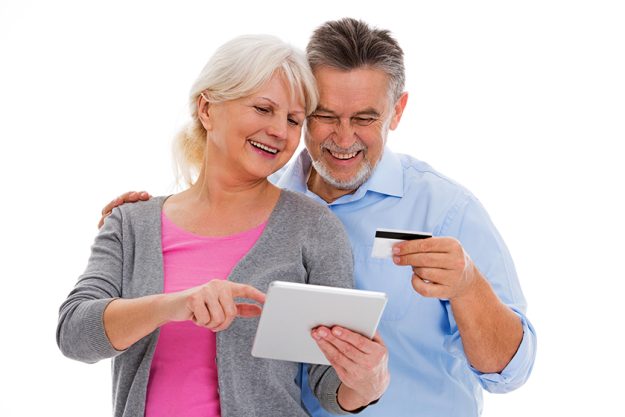 Elderly couple having fun with technology