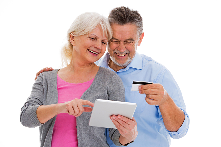 Elderly couple having fun with technology