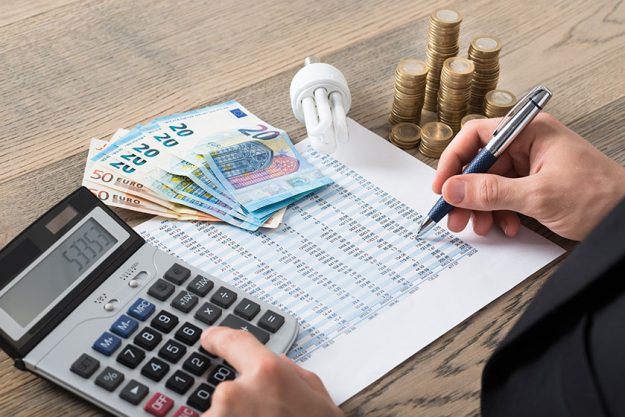 Man Calculating Energy Costs