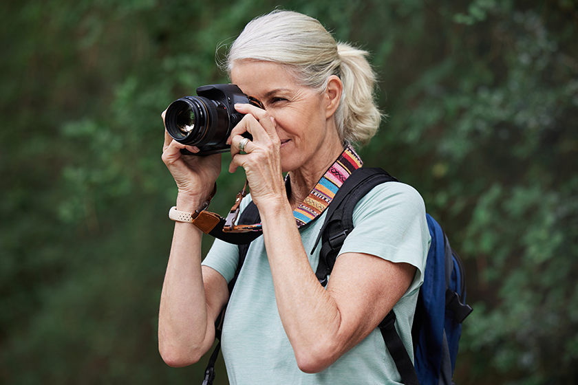 mature caucasian woman taking pictures