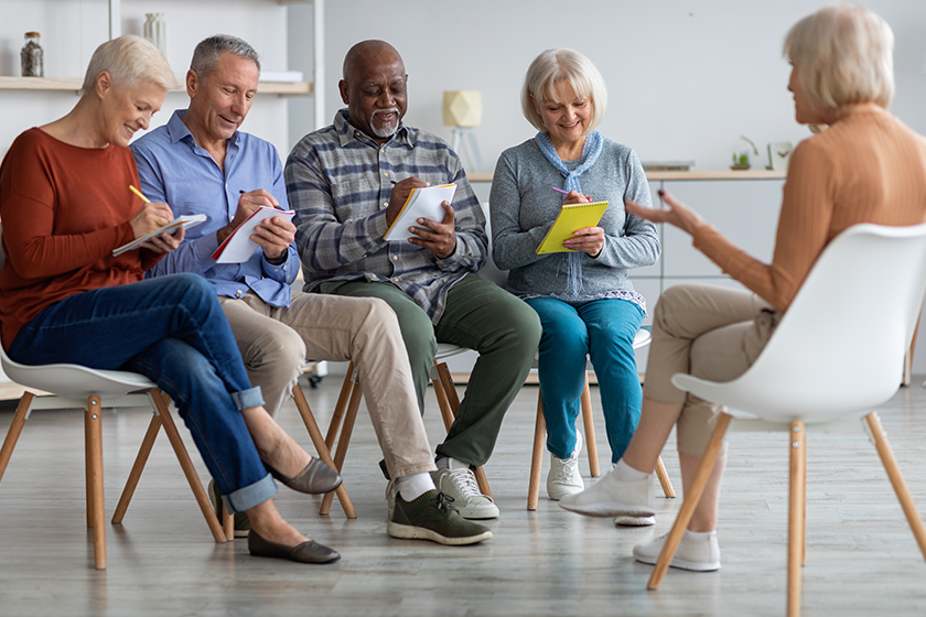 multiracial group of elderly men and women having educational class multiracial group of elderly men and women having educational class
