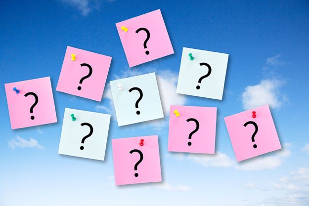 Question Concept on Blue Sky with Post It Notes