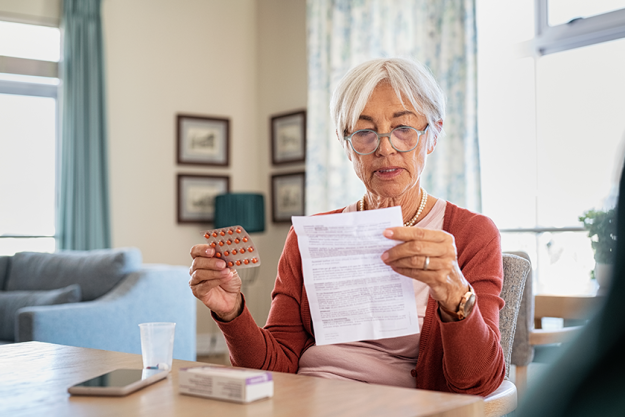 Senior woman checking prescription