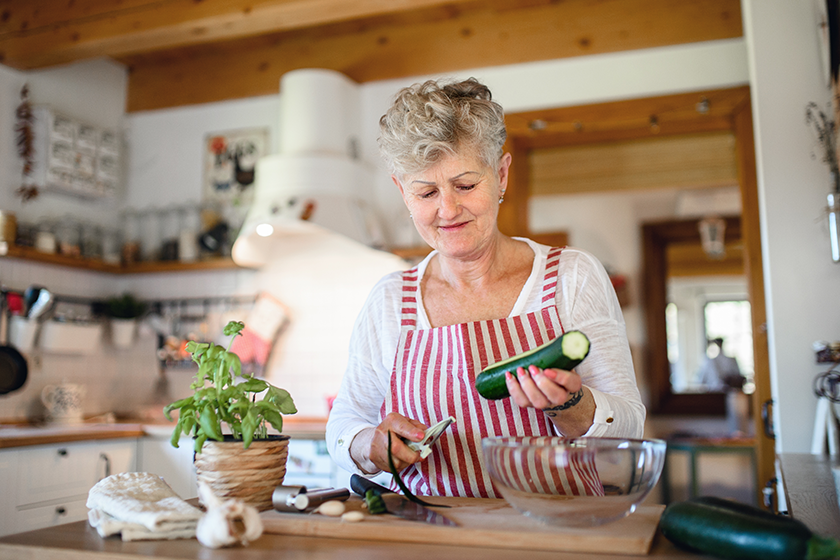woman cooking indoors at home woman cooking indoors at home