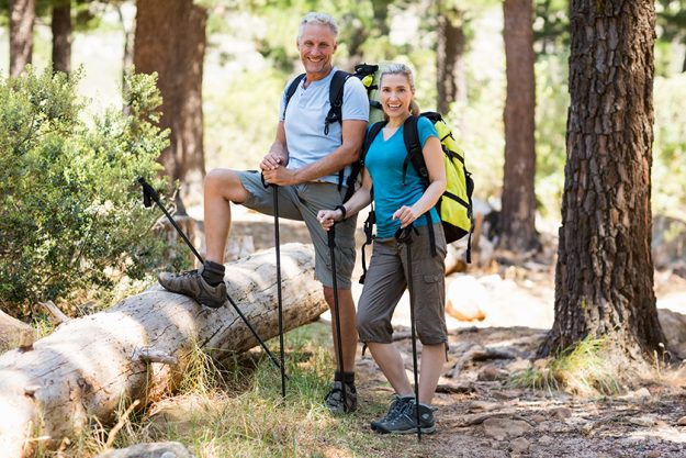 Couple smiling and posing during a hike