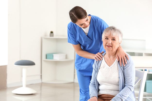 Female doctor with senior woman