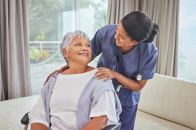 A hispanic senior woman in a wheelchair